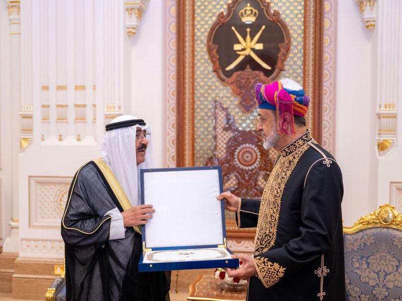 His Majesty the Sultan and His Highness the Emir of the State of Kuwait exchange medals and souvenirs